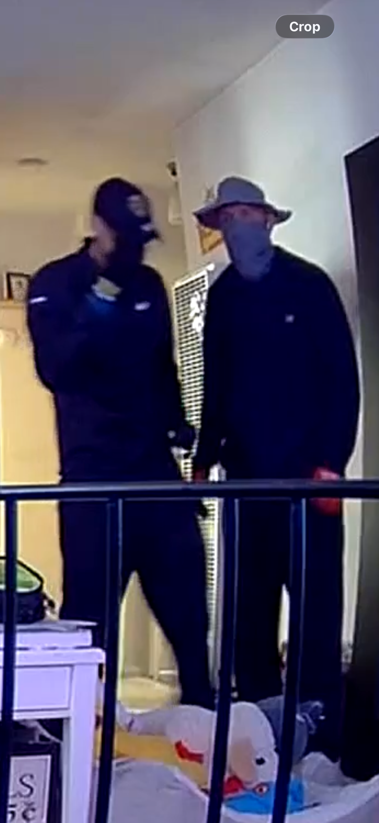 Two masked suspects on speakerphone