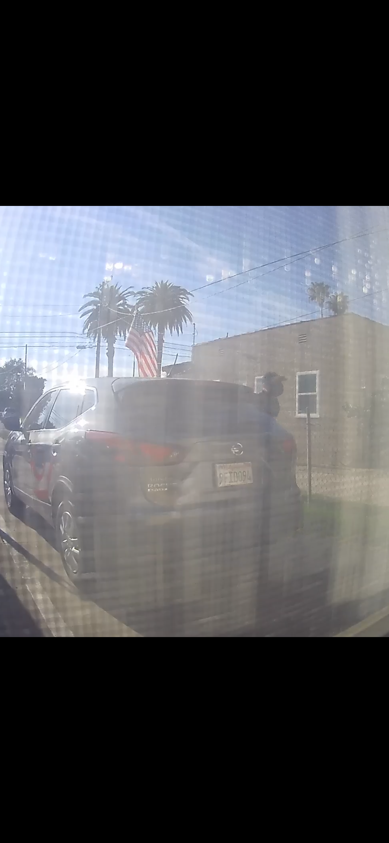 Getaway vehicle — light gray Nissan Rogue SUV